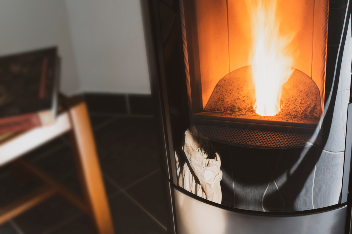 A residential biomass stove burning wood pellets
